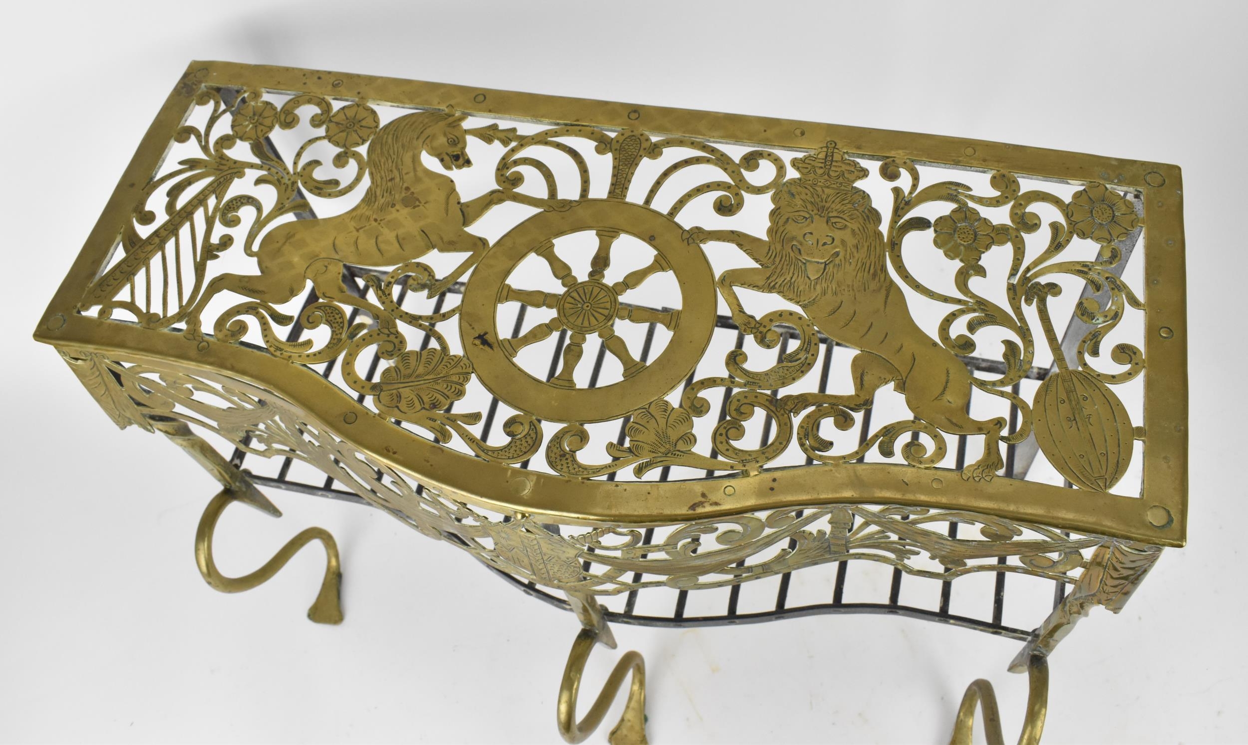 A Georgian brass and iron footman, 18th century, the serpentine fascia with pierced scrolls, - Image 4 of 7