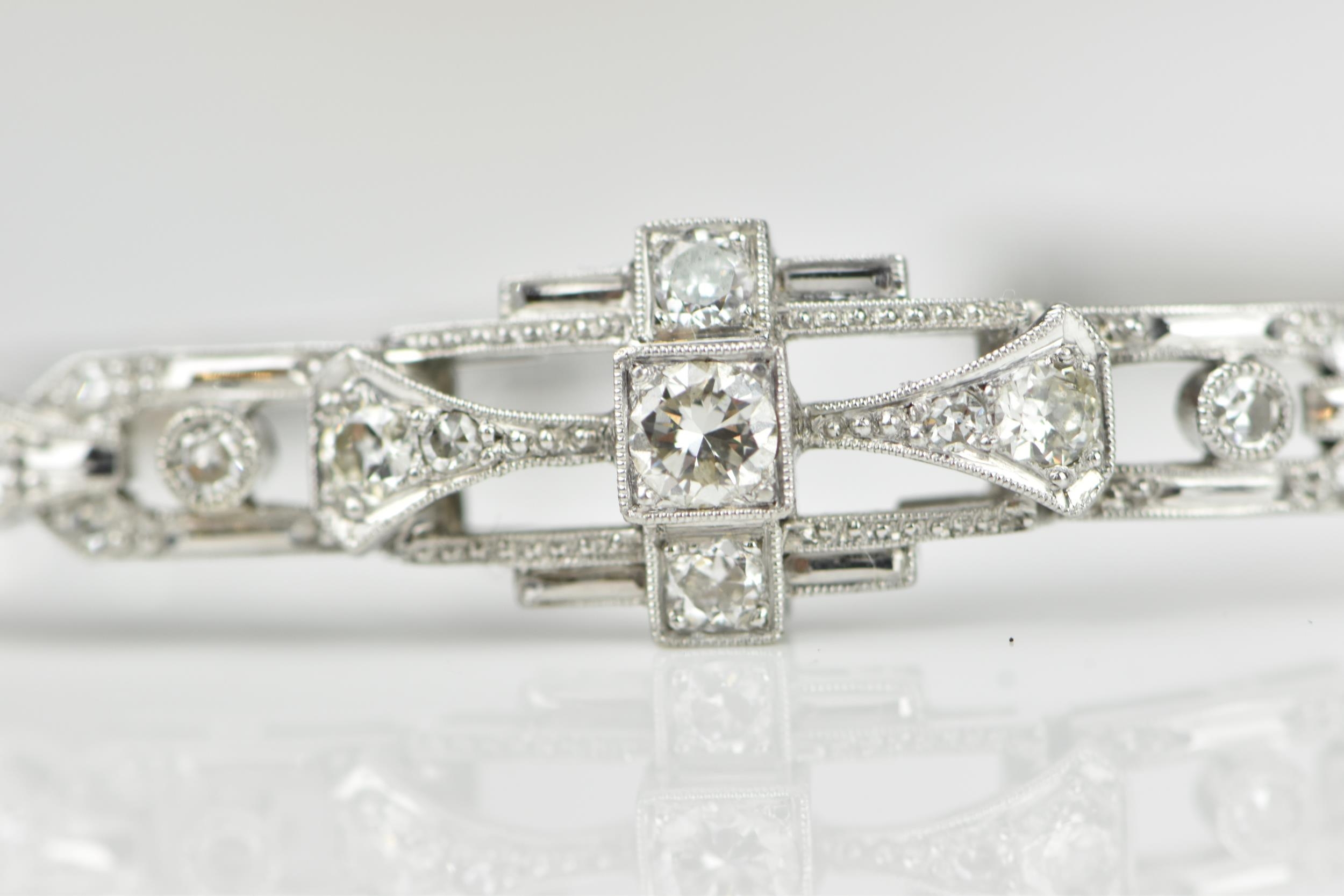 An Art Deco 18ct white gold and diamond bracelet, with stretch bracelet, inset with thirteen central - Image 10 of 11