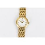 A Rotary quartz, ladies gold plated wristwatch having a white dial with baton markers, gold plated