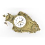 A 19th century French gilt metal Louis XV style wall hanging clock, the case having a torch finial