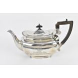 An Edwardian silver teapot by Elkington & Co Ltd, Birmingham 1904, with gadrooned border, turned