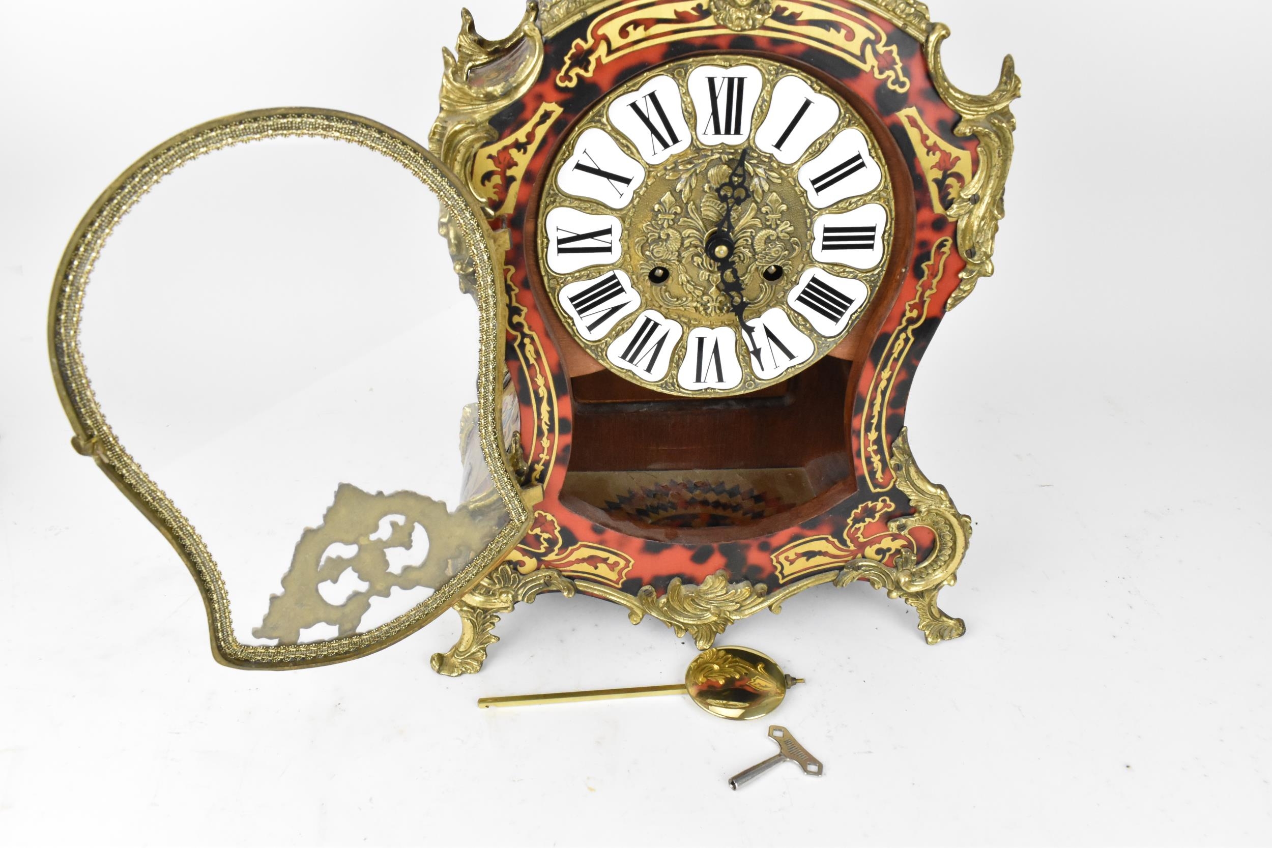 A 20th century French boulle work mantle clock having applied gilt metal C scroll and floral - Image 4 of 10