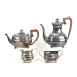 An Elizabeth II four piece silver tea and coffee set by Harrods Ltd of London, comprising a