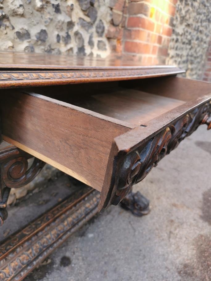 A 19th century Renaissance style carved oak library table, possibly French, with carved dolphin - Image 6 of 7