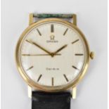 An Omega manual wind, gents, 9ct gold wristwatch, circa 1970 having a white dial with centre seconds