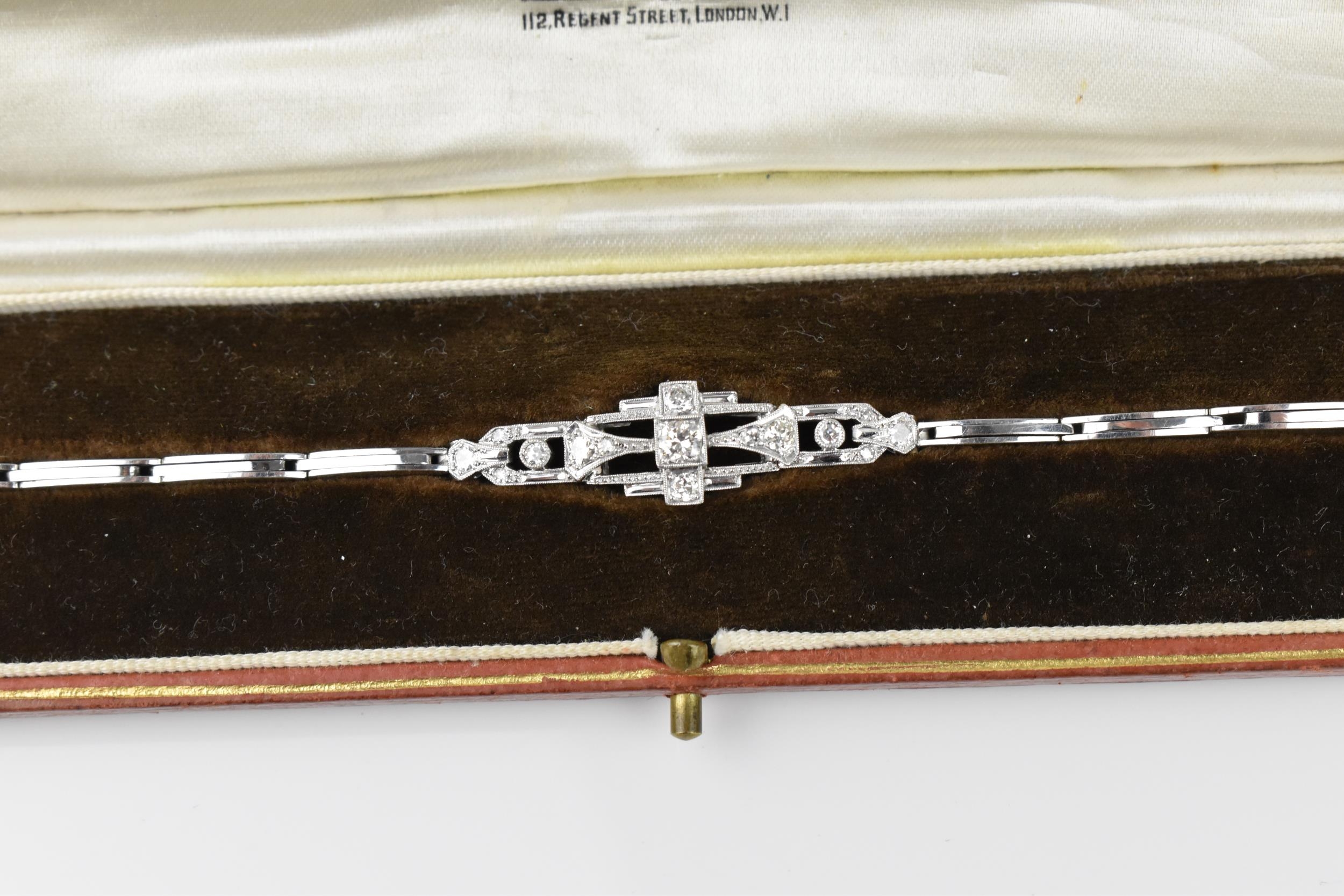 An Art Deco 18ct white gold and diamond bracelet, with stretch bracelet, inset with thirteen central - Image 3 of 11