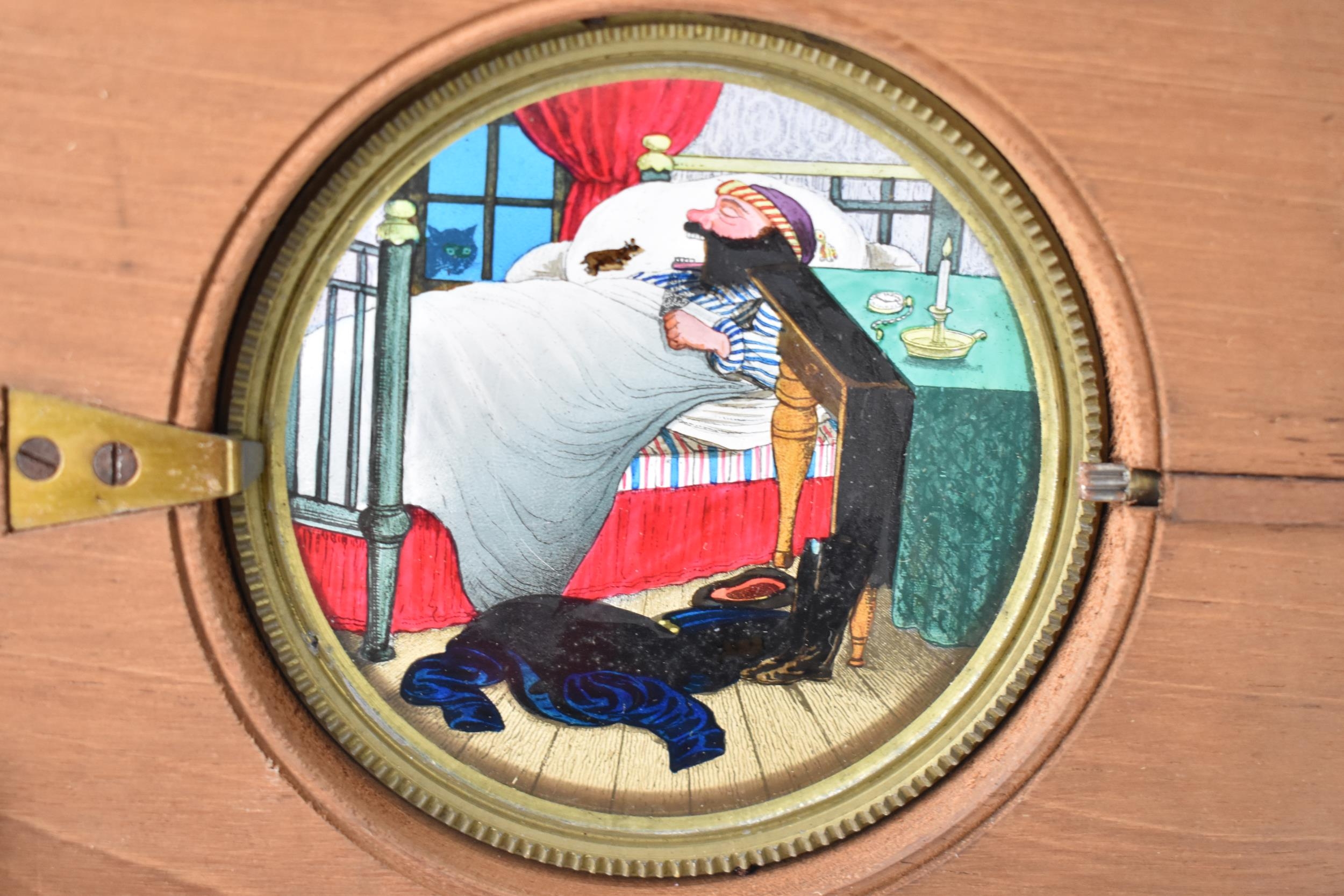 A Victorian mahogany-mounted hand painted rack and pinion magic lantern slide, depicting a - Image 2 of 4