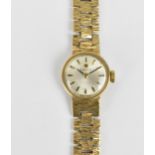 A Tissot manual wind, ladies 9ct gold wristwatch having a silvered dial with baton markers, 9ct gold