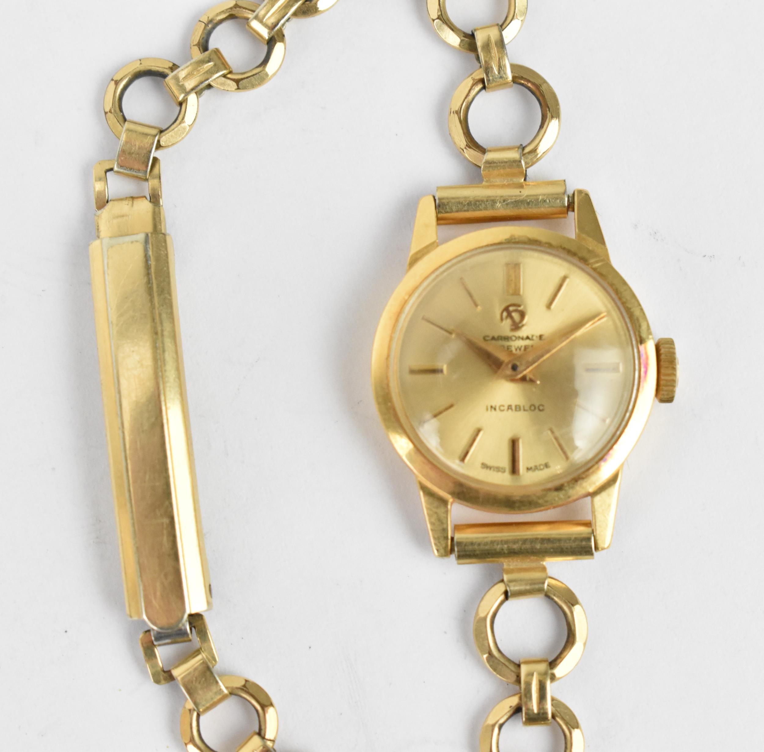 A Carronade manual wind, ladies 9ct gold cased wristwatch having a gilt dial with Arabic numerals on