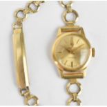 A Carronade manual wind, ladies 9ct gold cased wristwatch having a gilt dial with Arabic numerals on