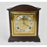 A reproduction Elliott mahogany arched top mantle clock retailed by Garrard & Co Ltd, the gilt