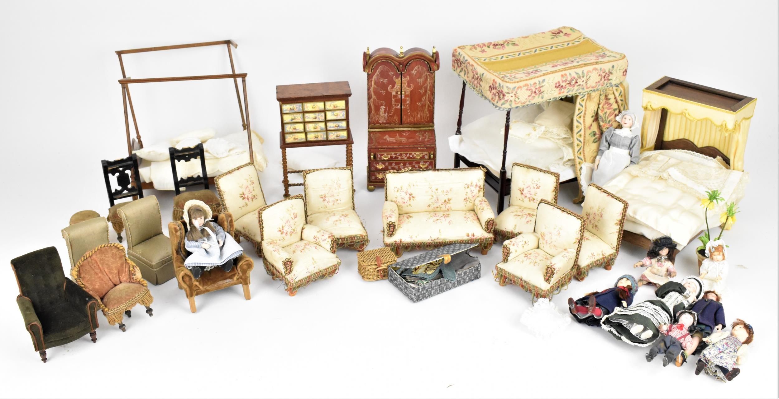 A collection of doll house furniture and dolls, to include two four poster beds, one with