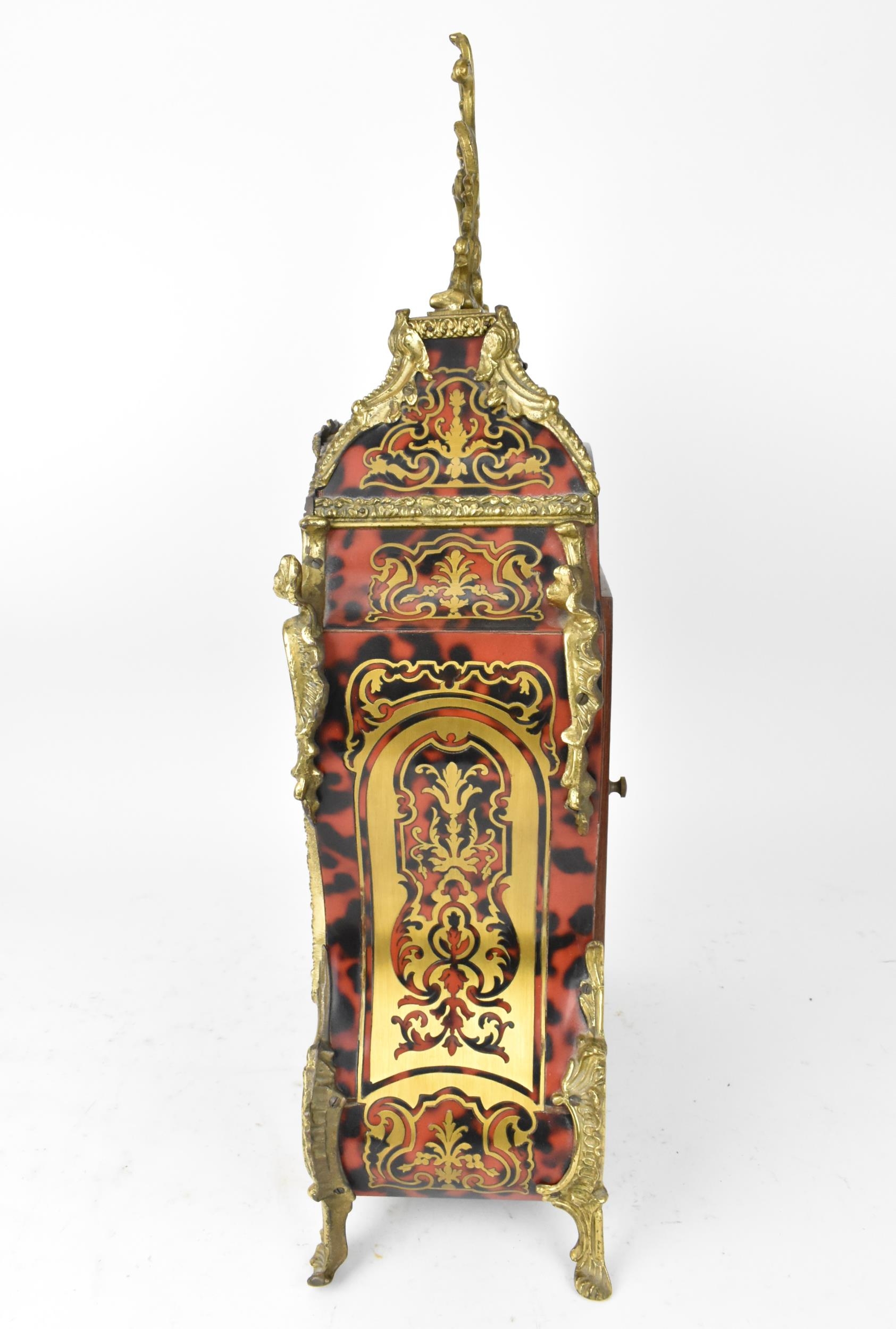 A 20th century French boulle work mantle clock having applied gilt metal C scroll and floral - Image 7 of 10