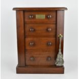 A late Victorian apprentice/miniature wellington chest, with graduated set of four drawers, with