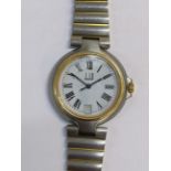A Dunhill quartz bi-coloured metal wristwatch with white enamel dial, the case back numbered 6111459