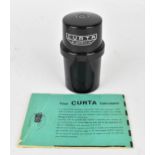 A Curta mechanical calculator type I, no. 63810, by Contina MG Mauren, invented by Curt Herzstark (