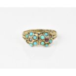 A 9ct yellow gold Georgian double pansy ring, inset with turquoise cabochon, seed pearl and purple