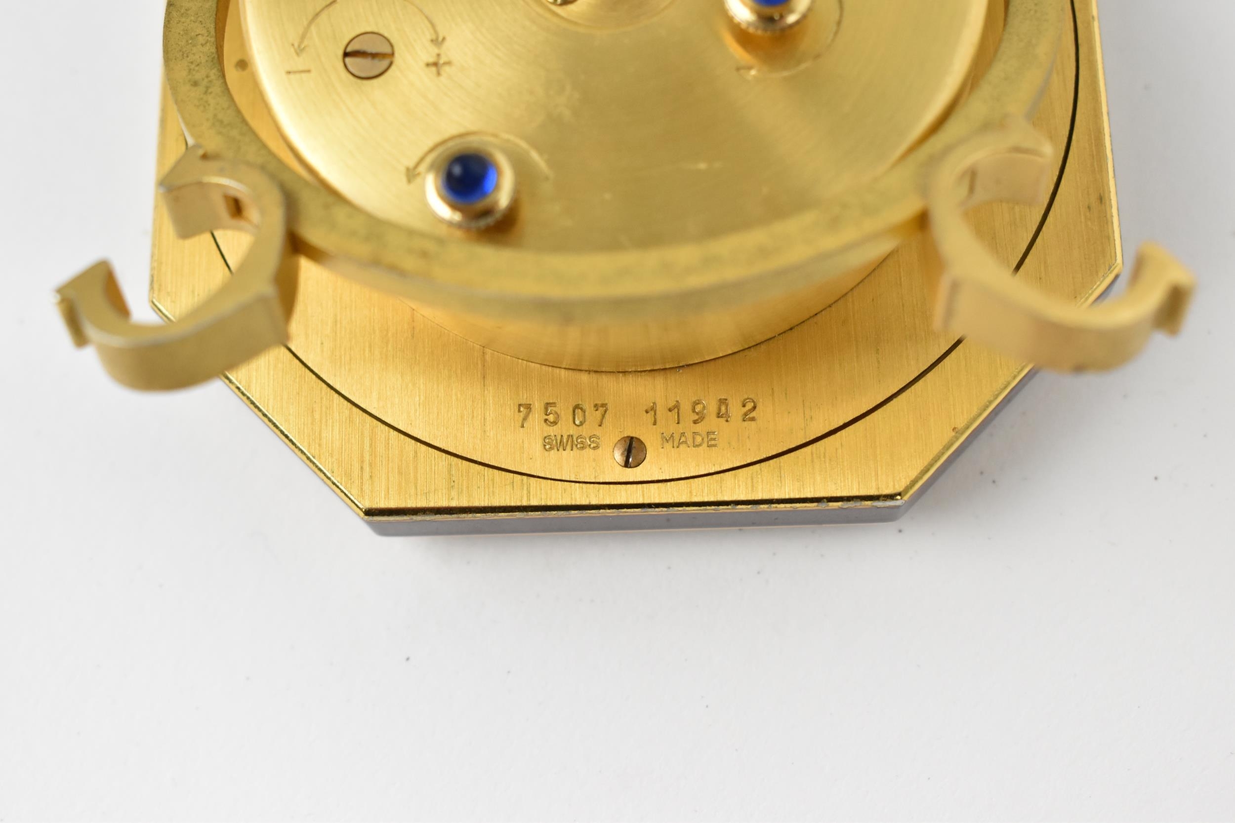 A Cartier manual wind, gilt brass and burgundy enamel travel clock having a white enamel dial with - Image 5 of 5