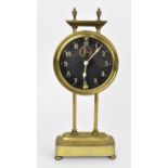 A late 19th/early 20th century brass cased gravity clock having a visual escapement, the Arabic