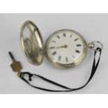 An early 19th century silver full hunter pocket watch having a white enamel dial, with gilt hands,