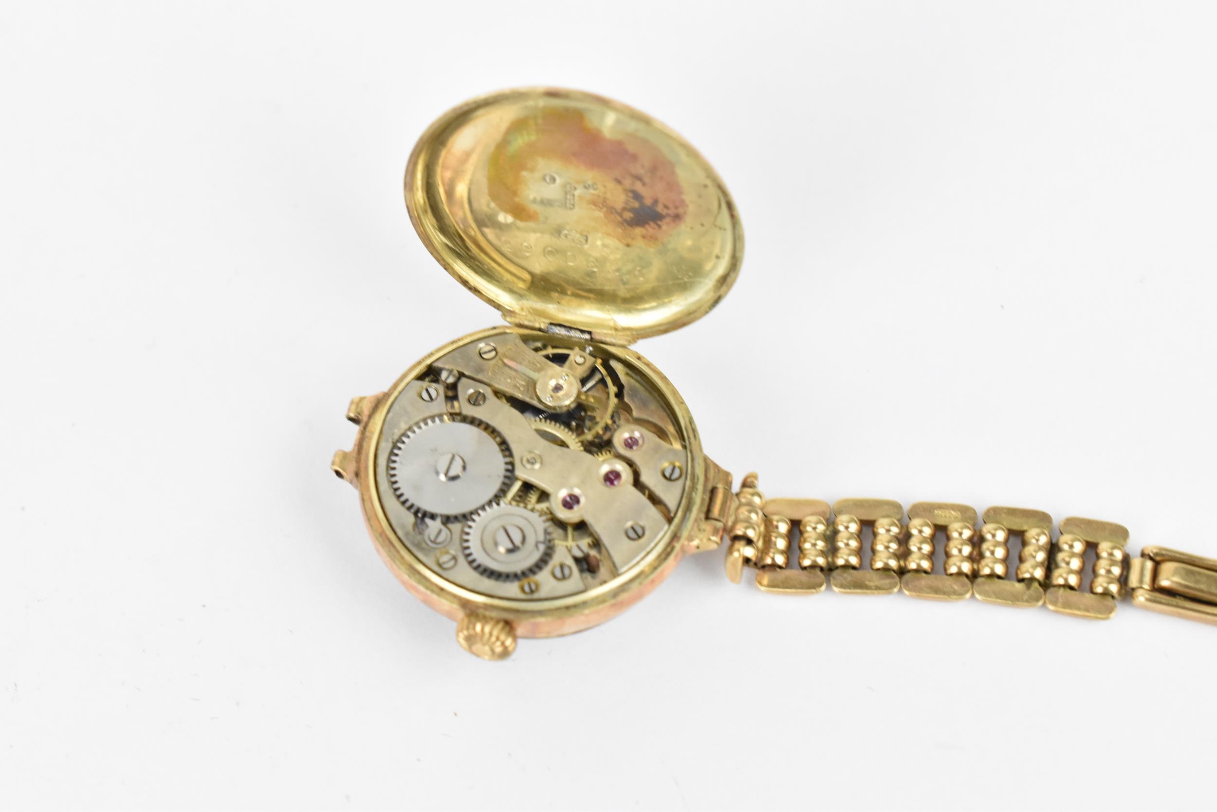 An early 20th century ladies 9ct gold cased manual wind wristwatch having a white enamel dial with - Image 3 of 3