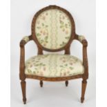 A Louis XVI style miniature armchair, with strawberry patterned silk upholstered medallion back,