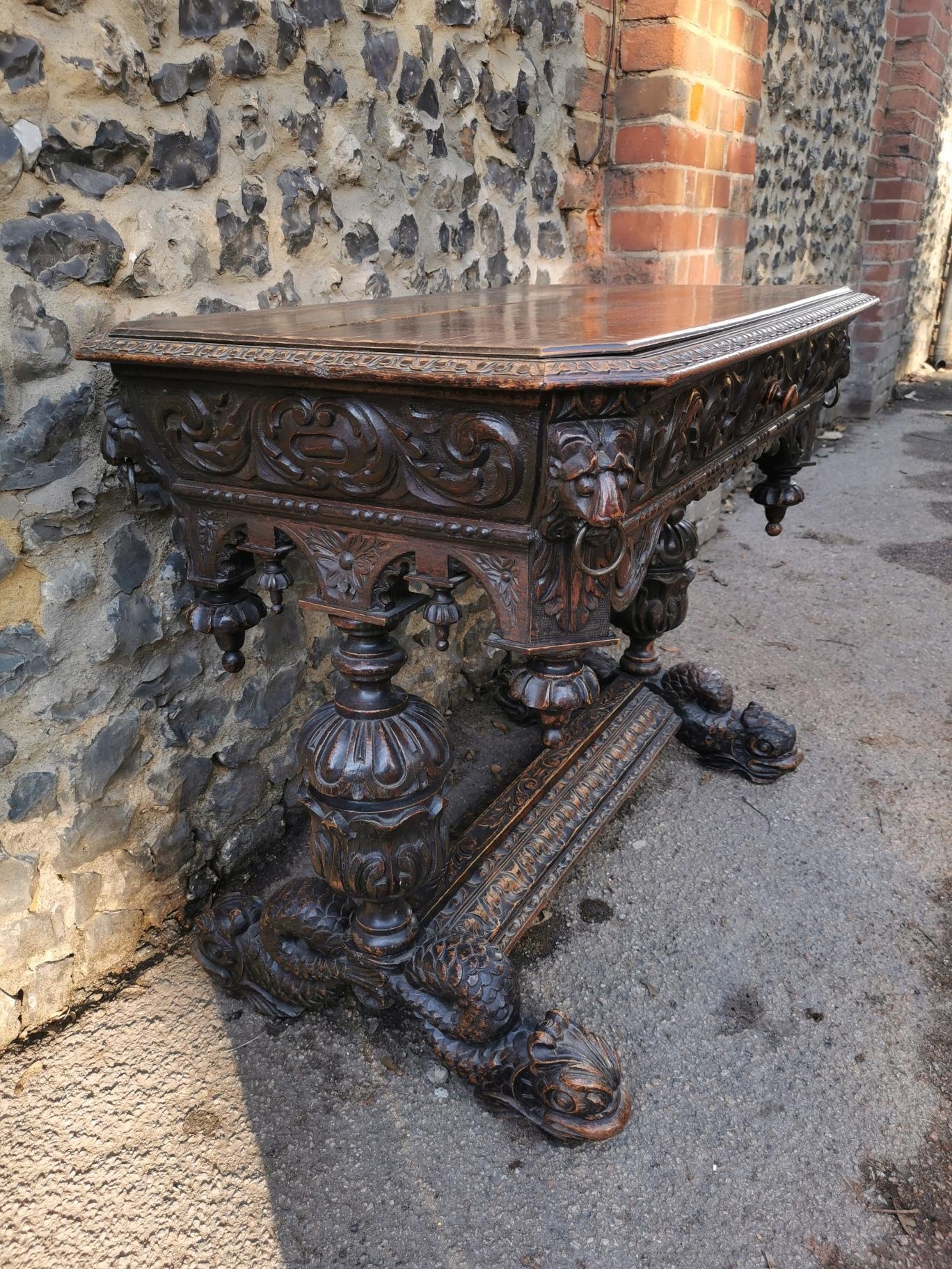 A 19th century Renaissance style carved oak library table, possibly French, with carved dolphin - Image 3 of 7