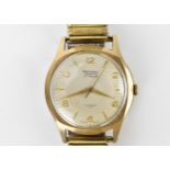 A Rotary, automatic, gents, 9ct gold wristwatch, having a silvered dial with centre seconds, gilt