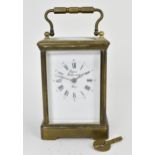 An early/mid 20th century brass cased carriage clock, white enamel dial signed 'Rapport Fondee en