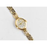 An Accurist Gold quartz, ladies 9ct gold cased wristwatch having a silvered dial signed Accurist