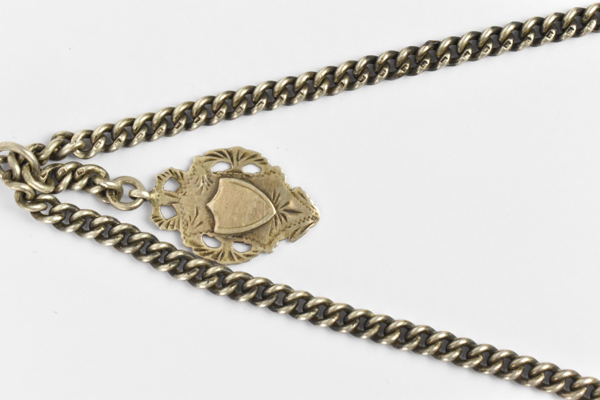 A late 19th/ early 20th century silver curb link pocket watch chain having a T-bar, silver fob and - Image 2 of 5