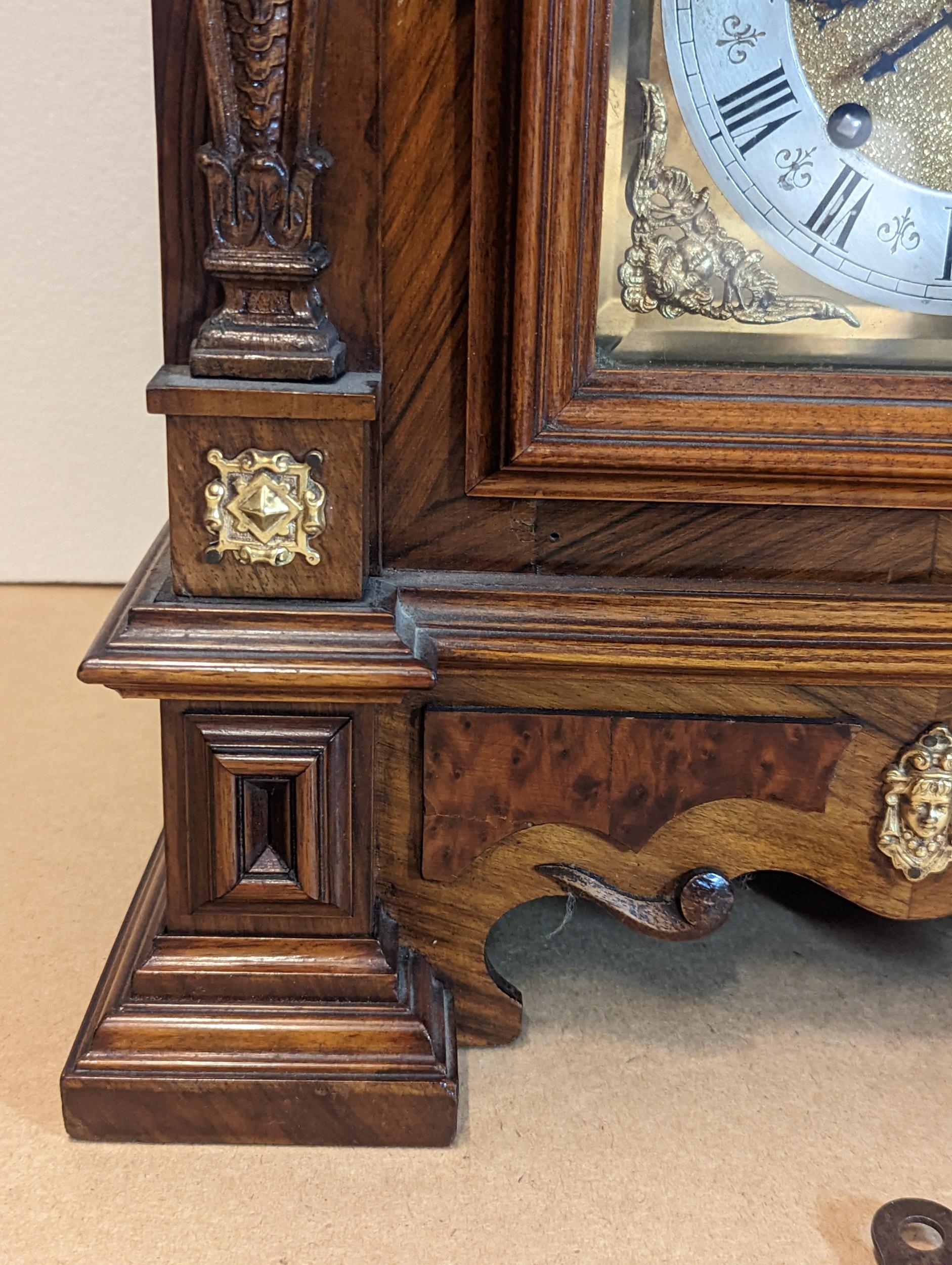 A late 19th century Reinhold Schnekenburger bracket clock with wall hanging bracket, the mixed