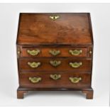 A George III period mahogany apprentice bureau, circa 1790, with fall front opening to a writing