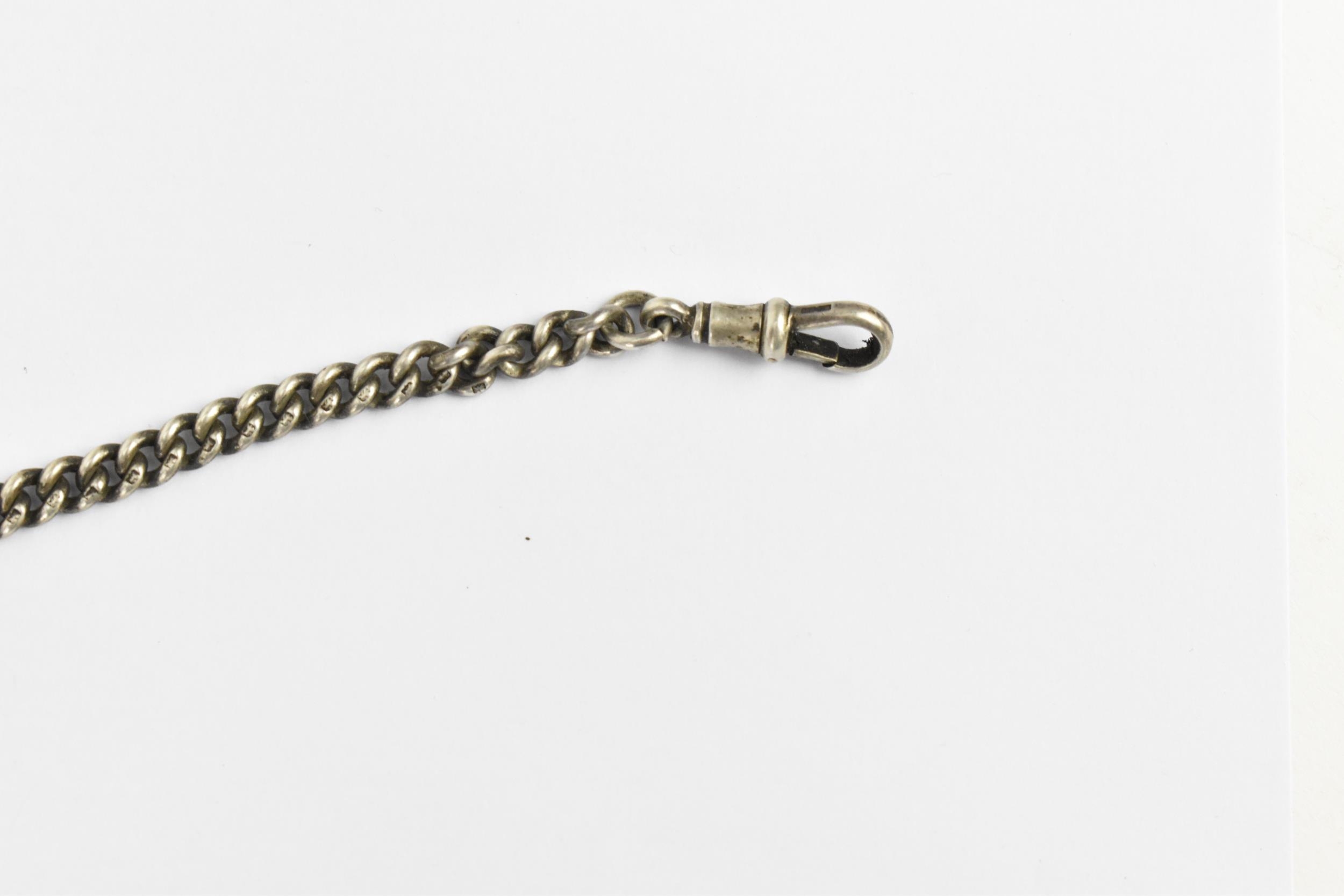 A late 19th/ early 20th century silver curb link pocket watch chain having a T-bar, silver fob and - Image 5 of 5