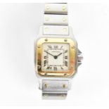 A Cartier, Santos, ladies/unisex bi-metal wristwatch, having a signed white enamel dial with Roman