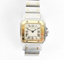 A Cartier, Santos, ladies/unisex bi-metal wristwatch, having a signed white enamel dial with Roman