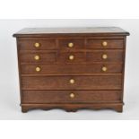 A Regency period mahogany apprentice chest of drawers, with moulded top above two sets of three