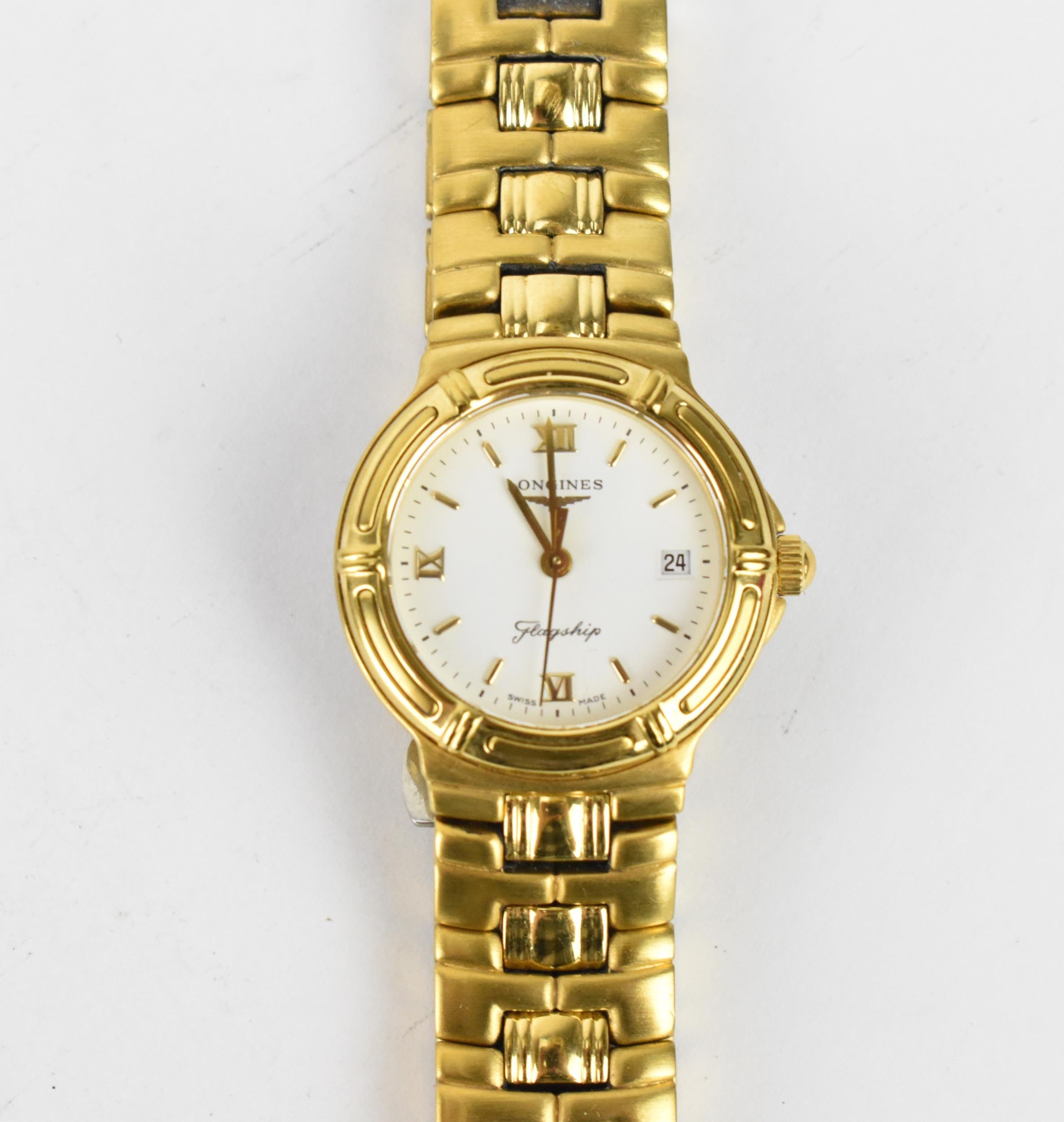 A Longines quartz, ladies gold plated wristwatch having a white enamel dial signed Longines Flagship