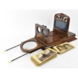 A Victorian mahogany stereoscopic viewer, together with a collection of stereoscopic cards, the