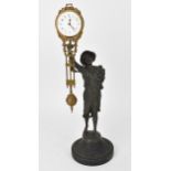 A 19th century novelty mystery clock modelled as a young onion selling boy with hat, mounted on