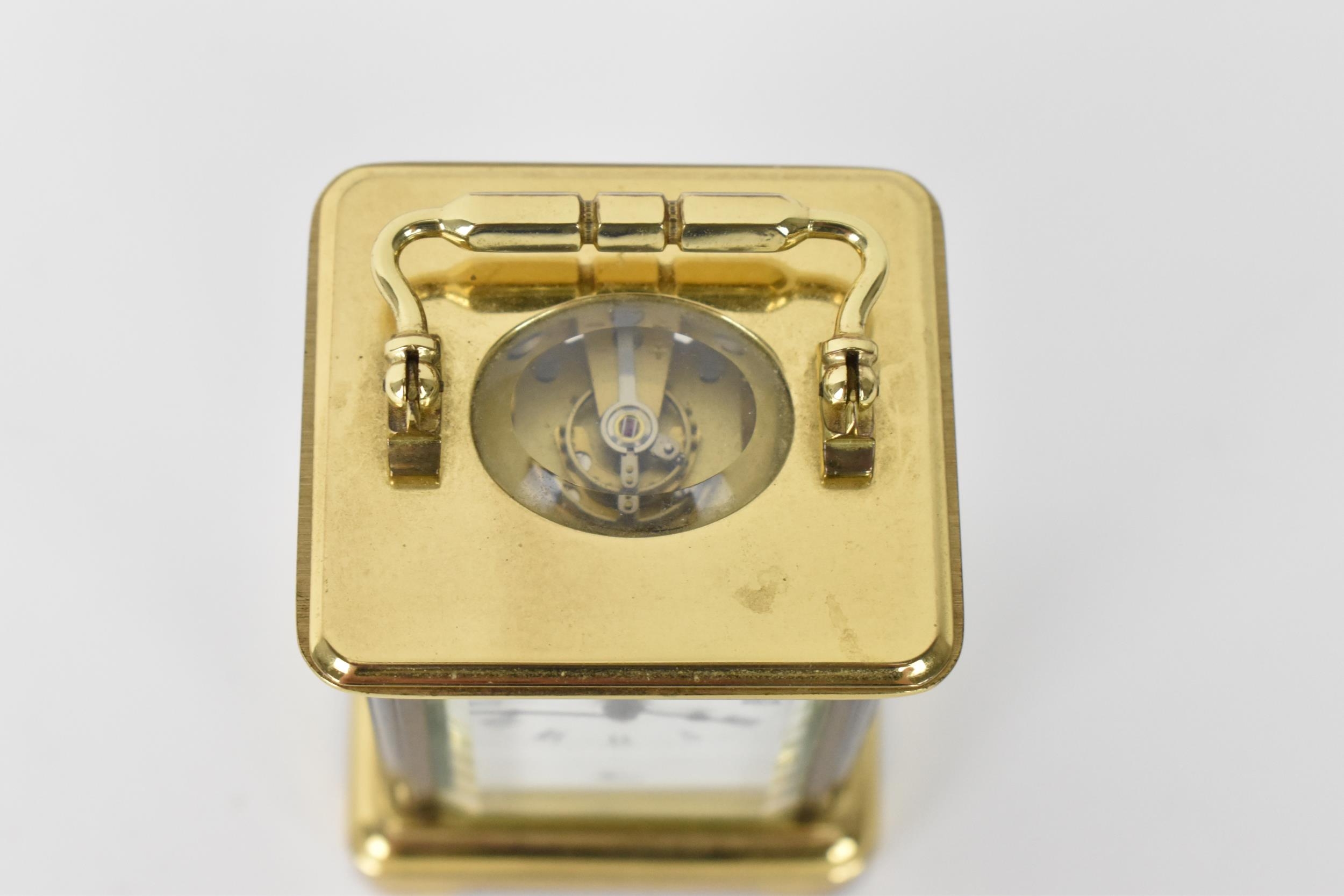 A modern L'Epee brass cased miniature carriage clock, white enamel dial with Roman numerals, the - Image 7 of 9