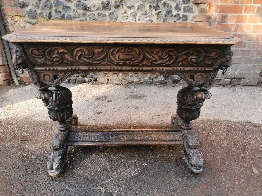 A 19th century Renaissance style carved oak library table, possibly French, with carved dolphin - Image 7 of 7