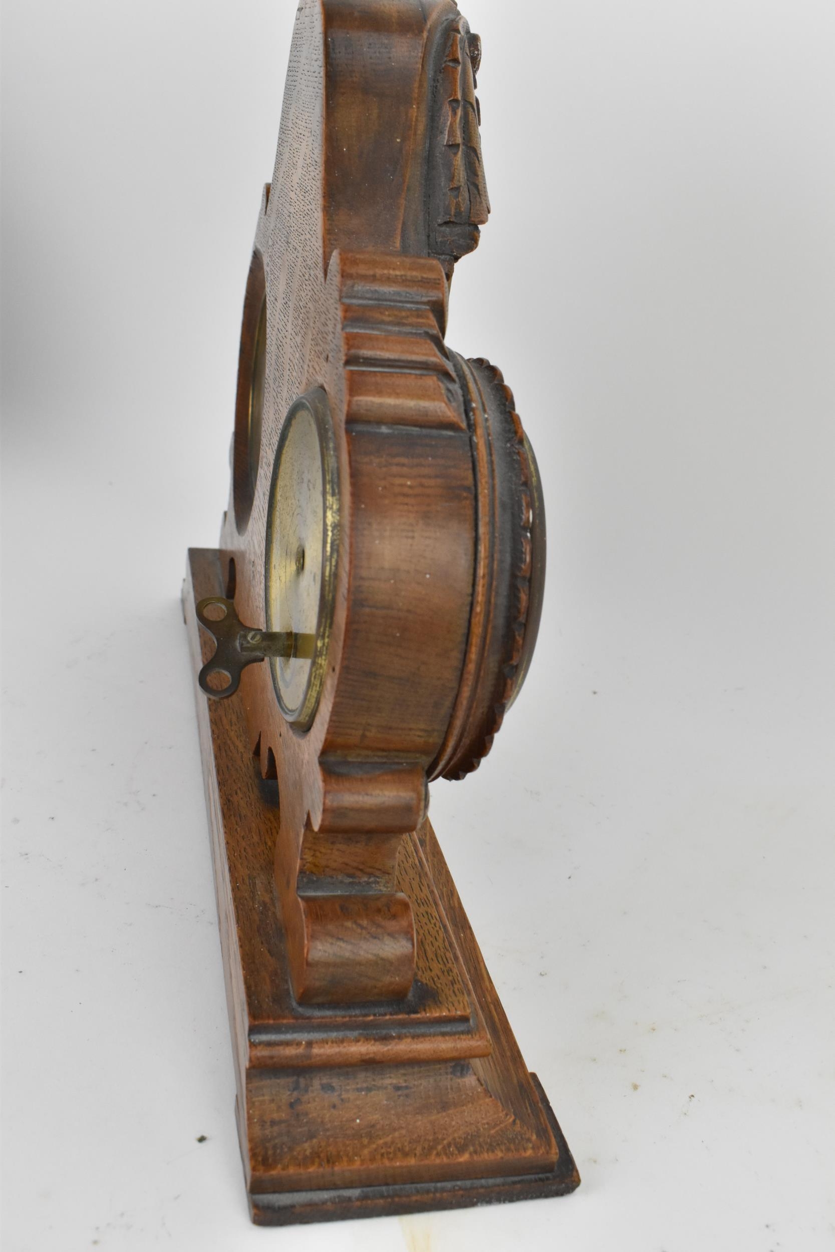 An early 20th century oak combination table clock, barometer and thermometer, having a scroll carved - Image 7 of 7