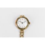 An early 20th century ladies 9ct gold cased manual wind wristwatch having a white enamel dial with