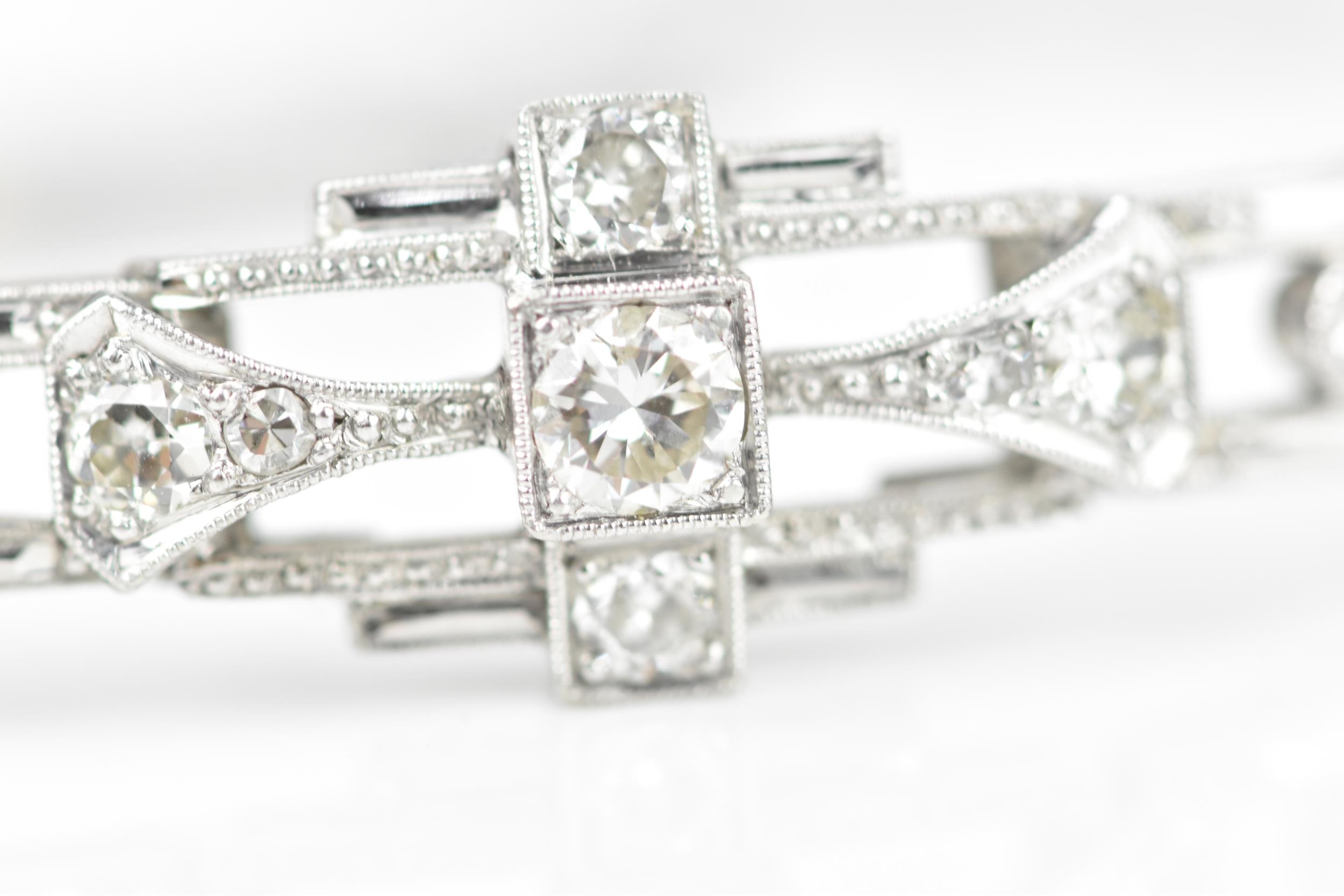 An Art Deco 18ct white gold and diamond bracelet, with stretch bracelet, inset with thirteen central - Image 8 of 11