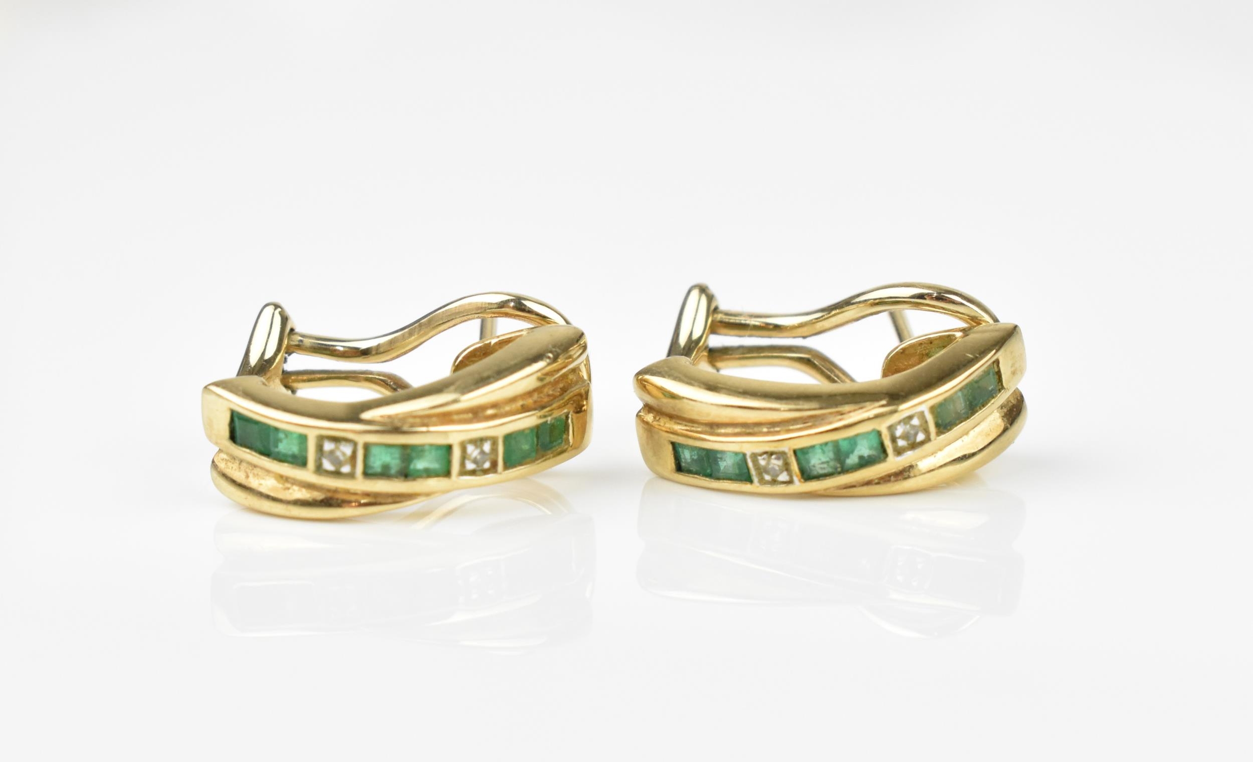 A pair of 9ct yellow gold, diamond and emerald earrings, with channel set princess cut emeralds in