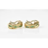 A pair of 9ct yellow gold, diamond and emerald earrings, with channel set princess cut emeralds in