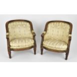 A pair of 18th century French Louis XVI bergère armchairs, circa 1780, with channelled mahogany