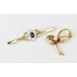 A 9ct yellow gold, cubic zirconia and dark stone floral brooch, together with a 9ct yellow gold,