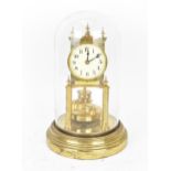 A circa 1900 Gustav Becker 400 day brass anniversary clock under a glass dome, having turned finials